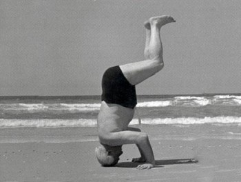 A muscle-bound dude works out on the beach in Tel Aviv