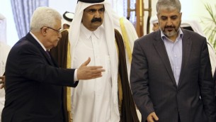 The Emir of Qatar Sheikh Hamad Bin Khalifa Al-Thani, center, Palestinian President Mahmoud Abbas, left, and Hamas leader Khaled Mashaal, right, arrive to sign an agreement in Doha, Qatar. A rare public rift broke open Sunday, Feb. 12, 2012 in the usually tightly disciplined Islamic movement Hamas over a reconciliation deal that would require it to relinquish key areas of control in the Gaza Strip. (photo credit: AP/Osama Faisal, File)