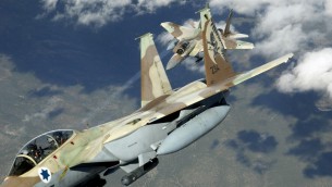 Two Israeli F-15I 'Ra'am' fighter jets during maneuvers. (photo credit: CC BY TSgt Kevin J. Gruenwald, USAF, Wikimedia) Two Israeli F-15I 'Ra'am' fighter jets during maneuvers. (photo credit: CC BY TSgt Kevin J. Gruenwald, USAF, Wikimedia)