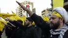 Hezbollah fighters take an oath to continue the path of resistance against Israel during a parade in 2000. (photo credit: AP/Hussein Malla)