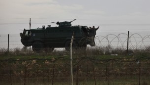 Egyptian soldiers ride an Armored Personnel Carrier (APC) along the border with Israel (photo credit: Tsafrir Abayov/Flash90)