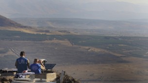 UN peacekeepers monitor the Syrian side of the border from an Israeli army post at Mount Bental near Kibbutz Merom Golan in the Golan Heights in July 2012. (Photo credit: Tsafrir Abayov/Flash90) UN peacekeepers monitor the Syrian side of the border from an Israeli army post at Mount Bental near Kibbutz Merom Golan in the Golan Heights in July 2012. (Photo credit: Tsafrir Abayov/Flash90)