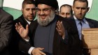 In this Monday, Sept. 17, 2012 file photo, Hezbollah leader Sheik Hassan Nasrallah, center, waves to his supporters, in the southern suburb of Beirut, Lebanon (photo credit: AP/Hussein Malla) In this Monday, Sept. 17, 2012 file photo, Hezbollah leader Sheik Hassan Nasrallah, center, waves to his supporters, in the southern suburb of Beirut, Lebanon (photo credit: AP/Hussein Malla)