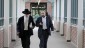Yosef Kolko, right, walks with an unidentified man, near the Ocean County Courthouse in Toms River, NJ, Thursday, May 9, 2013, during a break in his trial on sexual assault charges. (photo credit: AP Photo/Mel Evans)