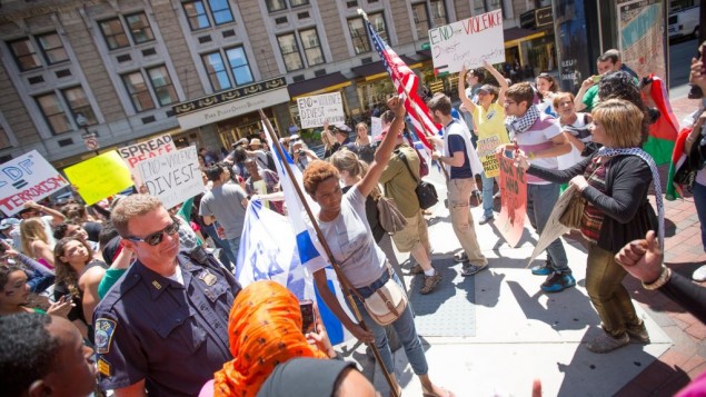 At an anti-Israel protest in Boston on Friday, pro-Palestinian activists surrounded several Israel supporters, hurling insults and allegedly physically assaulting pro-Israel students (photo credit: Elan Kawesch/The Times of Israel) At an anti-Israel protest in Boston on Friday, pro-Palestinian activists surrounded several Israel supporters, hurling insults and allegedly physically assaulting pro-Israel students (photo credit: Elan Kawesch/The Times of Israel)