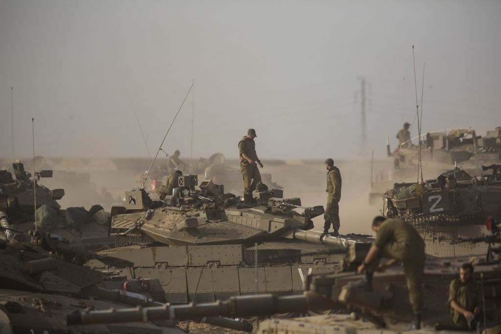 IDF tanks and soldiers in southern Israel near the border with Gaza, on the fifth day of Operation Protective Edge, July 12, 2014. (photo credit: Yonatan Sindel/Flash90) IDF tanks and soldiers in southern Israel near the border with Gaza, on the fifth day of Operation Protective Edge, July 12, 2014. (photo credit: Yonatan Sindel/Flash90)