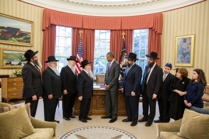 President Barack Obama presents a ceremonial copy of the Education and Sharing Day Proclamation that he issued on March 31, 2015 to a delegation from the American Friends of Lubavitch in the Oval Office, April 27, 2015. (Photo credit: Pete Souza/White House) President Barack Obama presents a ceremonial copy of the Education and Sharing Day Proclamation that he issued on March 31, 2015 to a delegation from the American Friends of Lubavitch in the Oval Office, April 27, 2015. (Photo credit: Pete Souza/White House)