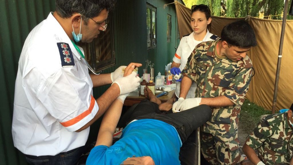 A photo released by Magen David Adom on Tuesday, April 28 2015 shows a Magen David Adom paramedic treating a patient in Kathmandu, Nepal, after the earthquake that hit the country last week. (Photo credit: Courtesy Magen David Adom) A photo released by Magen David Adom on Tuesday, April 28 2015 shows a Magen David Adom paramedic treating a patient in Kathmandu, Nepal, after the earthquake that hit the country last week. (Photo credit: Courtesy Magen David Adom)