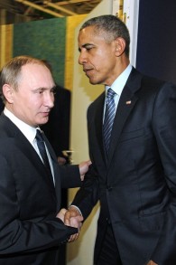Russian President Vladimir Putin, left, and U.S. President Barack Obama shake hands at the COP21 UN Conference on Climate Change in Paris, France, Monday, Nov. 30, 2015 (Mikhail Klimentyev/Sputnik, Kremlin Pool Photo via AP)