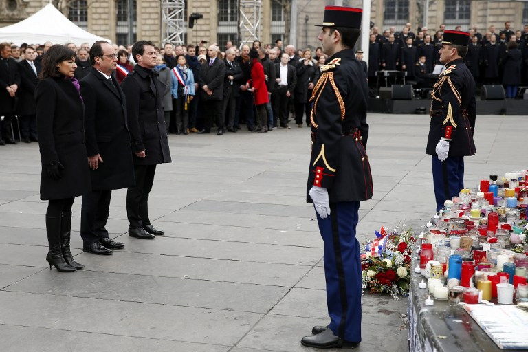 (From L) Mayor of Paris Anne Hidalgo, French President Francois Hollande and French Prime Minister Manuel Valls attend a remembrance rally at Place de la Republique (Republic square) on January 10, 2016 to mark a year since 1.6 million people thronged the French capital in a show of unity after attacks on the Charlie Hebdo newspaper and a Jewish supermarket. (AFP / POOL / YOAN VALAT) (From L) Mayor of Paris Anne Hidalgo, French President Francois Hollande and French Prime Minister Manuel Valls attend a remembrance rally at Place de la Republique (Republic square) on January 10, 2016 to mark a year since 1.6 million people thronged the French capital in a show of unity after attacks on the Charlie Hebdo newspaper and a Jewish supermarket. (AFP / POOL / YOAN VALAT)