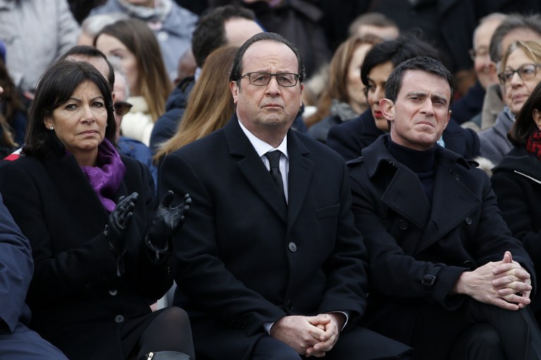 (From L) French Paris' Mayor Anne Hidalgo, French President Francois Hollande and French Prime Minister Manuel Valls attend a remembrance rally at Place de la Republique (Republic square) on January 10, 2016 to mark a year since 1.6 million people thronged the French capital in a show of unity after attacks on the Charlie Hebdo newspaper and a Jewish supermarket. (AFP / POOL / YOAN VALAT) (From L) French Paris' Mayor Anne Hidalgo, French President Francois Hollande and French Prime Minister Manuel Valls attend a remembrance rally at Place de la Republique (Republic square) on January 10, 2016 to mark a year since 1.6 million people thronged the French capital in a show of unity after attacks on the Charlie Hebdo newspaper and a Jewish supermarket. (AFP / POOL / YOAN VALAT)