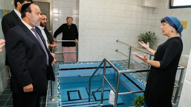 Israeli Minister of Religious Services David Azulay visits a luxury mikvah in the Israeli settlement of Alon Shvut, as he tours the Gush Etzion bloc on August 25, 2015. (Gershon Elinson/Flash90)