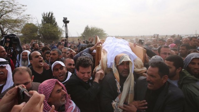 Joint (Arab) List leader MK Ayman Odeh holds the body of Yaqoub Mousa Abu Al-Qia’an, 