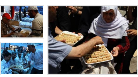 Screenshot from wattan.tv news from Jun 14, 2014 of Arabs celebrating the kidnapping of 3 kids.