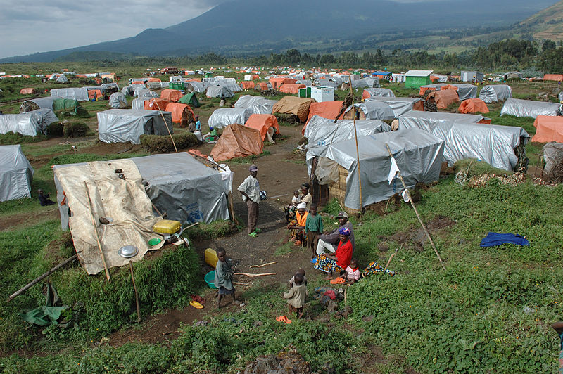 Refugee camp in Congo {By Julien Harneis [CC BY-SA 1.0 (http://creativecommons.org/licenses/by-sa/1.0) or CC BY-SA 2.0 (http://creativecommons.org/licenses/by-sa/2.0)], via Wikimedia Commons}