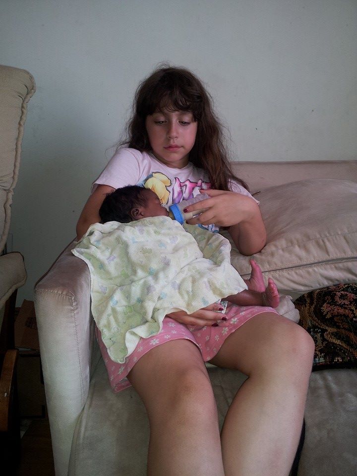 10592693_10154541444205597_8655502717156205976_n Feeding one of our 17 "dolls."