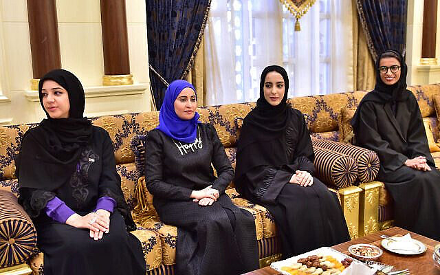In this Feb. 14, 2016 image released by the Emirates News Agency, WAM, and made available today, from left to right, Reem Ibrahim Al Hashimi, UAE Minister of State for International Cooperation, Ohood Al Roumi appointed as Minister of State for Happiness, Shamma Al Mazrui appointed as Minister of State for Youth and Noura Al Kaabi, UAE Minister of State for FNC Affairs, take part at swearing-in ceremony for ministers in Abu Dhabi, United Arab Emirates. (WAM via AP)