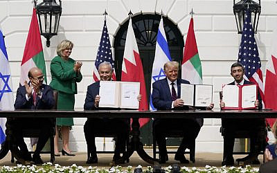 President Donald Trump, center, with from left, Bahrain Foreign Minister Khalid bin Ahmed Al Khalifa, Israeli Prime Minister Benjamin Netanyahu, Trump, and United Arab Emirates Foreign Minister Abdullah bin Zayed al-Nahyan, during the Abraham Accords signing ceremony on the South Lawn of the White House, Tuesday, Sept. 15, 2020, in Washington. (AP Photo/Alex Brandon)