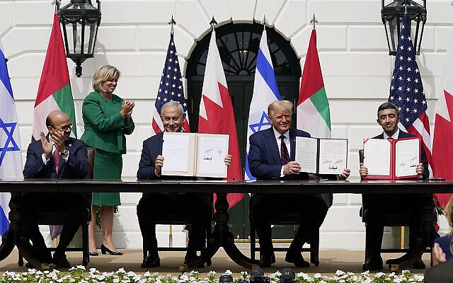 President Donald Trump, center, with from left, Bahrain Foreign Minister Khalid bin Ahmed Al Khalifa, Israeli Prime Minister Benjamin Netanyahu, Trump, and United Arab Emirates Foreign Minister Abdullah bin Zayed al-Nahyan, during the Abraham Accords signing ceremony on the South Lawn of the White House, Tuesday, Sept. 15, 2020, in Washington. (AP Photo/Alex Brandon)